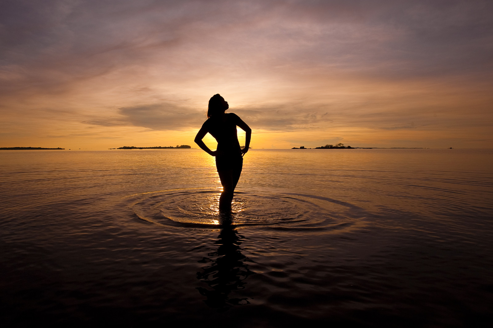 Graceful Woman in silhouette at sunset