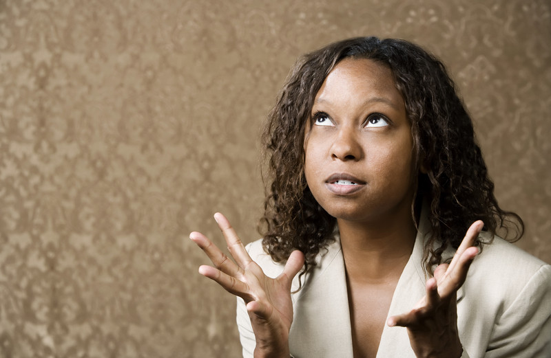 Black woman stressed looking at sky